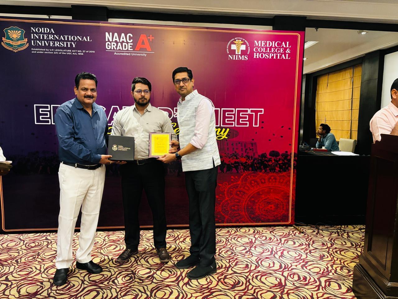 Receiving certificate from university officials